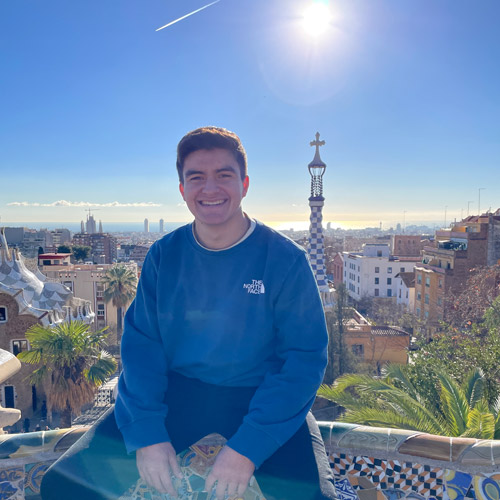 Portrait of Marques sitting on a balcony in Spain.