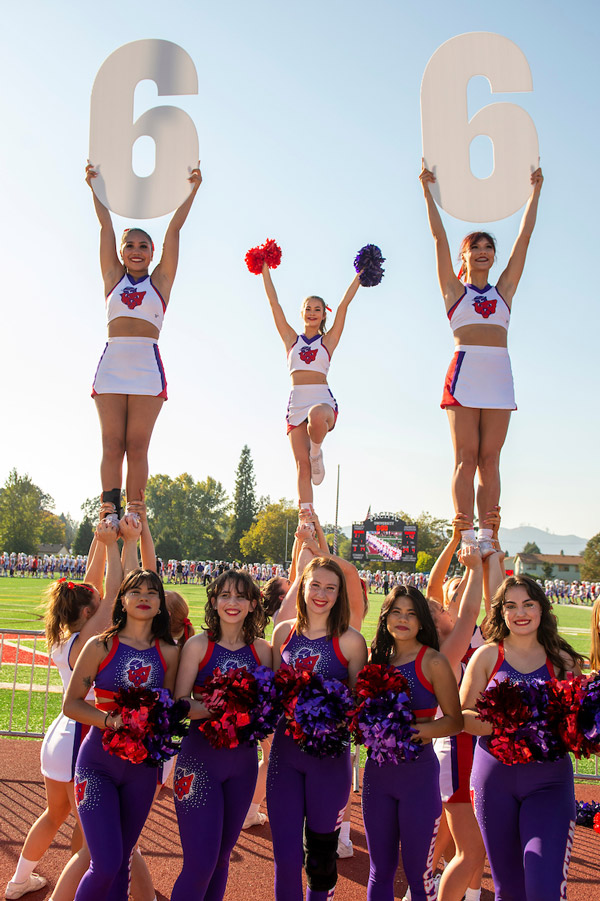 The cheer and dance teams in formation during a Wildcat football game, fall 2022