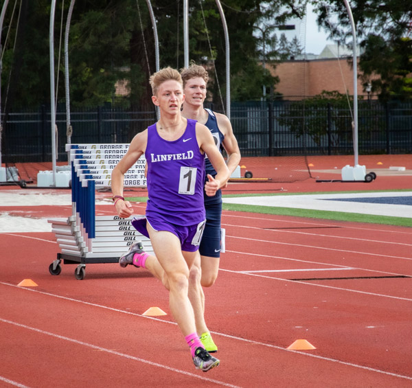 Evan racing during a Linfield Men's Cross Country meet at George Fox