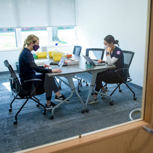 male nursing students studying