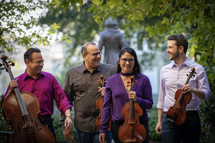 Members of the Dali Quartet holding their instruments.