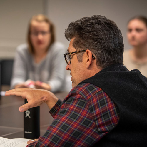 Professor Sumner speaking to his class