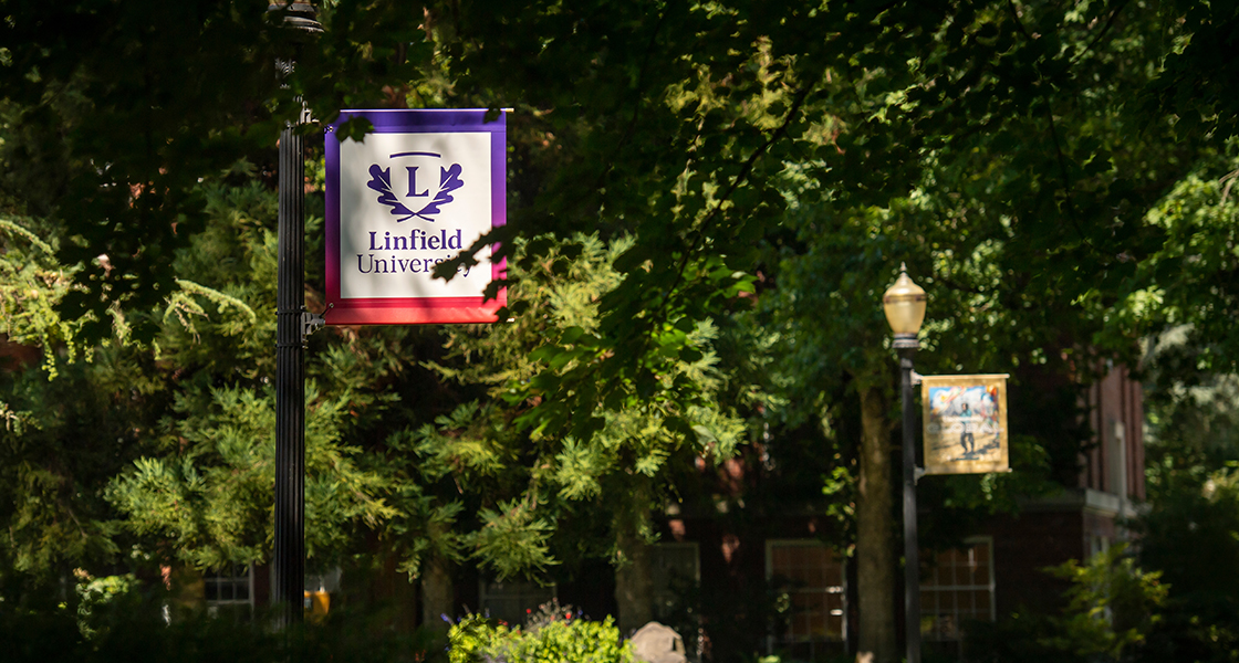 campus photo of a Linfield banner.