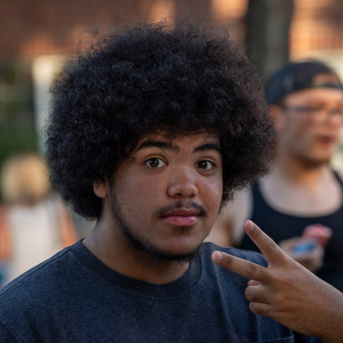 male student flashing the peace sign