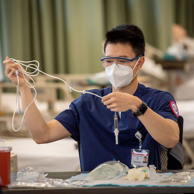 male nursing student in lab